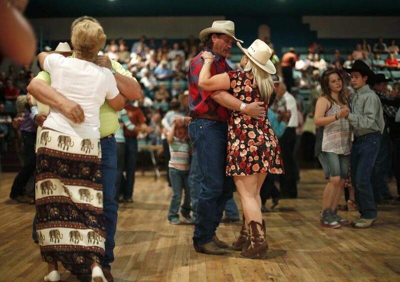 People dance to a band during the annual fiesta in Truth or Consequences, New Mexico. Many agree that Spaceport America should inject new energy into the town. Lucy Nicholson / Reuters