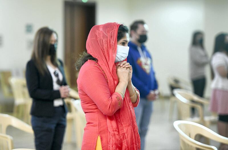 Abu Dhabi, United Arab Emirates - Worshippers follow guidelines and social distance during Christmas mass at St. JosephÕs Cathedral, in Mushrif. Khushnum Bhandari for The National