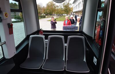 Inside view of the first German autonomous public transport bus during a presentation in Bad Birnbach, southern Germany, on October 25, 2017. 
German state-owned rail company Deutsche Bahn unveiled its first-ever driverless bus Wednesday, saying the shuttle will bring passengers through a picturesque spa town to the train station. The first autonomous minibus can transport six passengers. It will travel on a partial public transport route of 700 meters in the small town of Bad Birnbach Lower Bavaria. / AFP PHOTO / Christof STACHE