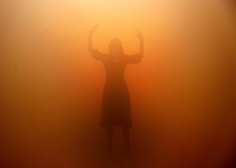 A visitor tries to orientate through a room full of fog called 'Your blind passenger' as part of the exhibition Olafur Eliasson: 'In real life' at the Tate Modern Gallery in London, Tuesday, July 9, 2019. The Tate Modern has brought together around 40 works of Eliasson spanning the last three decades, and are on display from July 11, 2019 until January 5, 2020. (AP Photo/Frank Augstein)