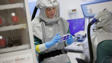 A biologist at the French-Austrian biotech company Valneva works on an inactivated whole-virus vaccine against the coronavirus in Vienna, Austria, in December 2021. Reuters