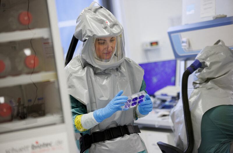 A biologist at the French-Austrian biotech company Valneva works on an inactivated whole-virus vaccine against the coronavirus in Vienna, Austria, in December 2021. Reuters