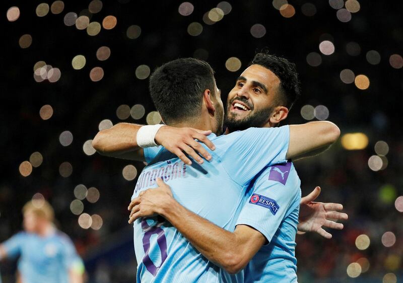 Manchester City's Ilkay Gundogan celebrates scoring their second goal with Riyad Mahrez, who had earlier opened the scoring. Reuters