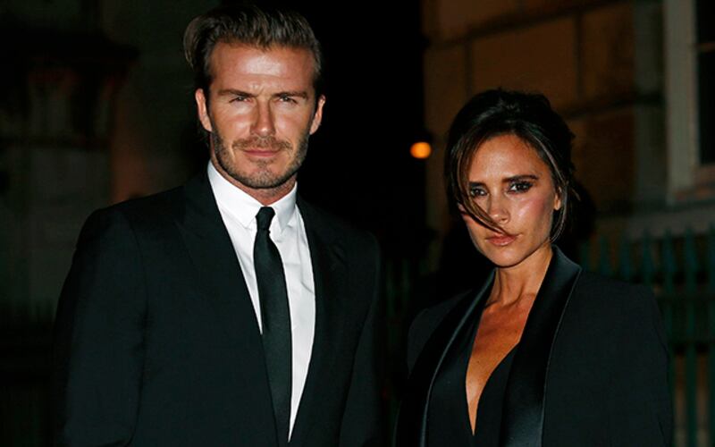 Former England soccer captain David Beckham and his wife Victoria Beckham arrive for a London Fashion Week event to celebrate the Global Fund in London September 16, 2013.  REUTERS/Eddie Keogh (BRITAIN - Tags: FASHION ENTERTAINMENT SPORT SOCCER)