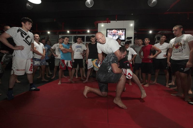 Fedor Emelianenko, the former mixed martial arts champion, takes the workshop at the Glory MMA and Fitness Centre in Dubai. ‘It’s amazing how intelligent he is,’ said one long-time fan. Jeffrey E Biteng / The National 