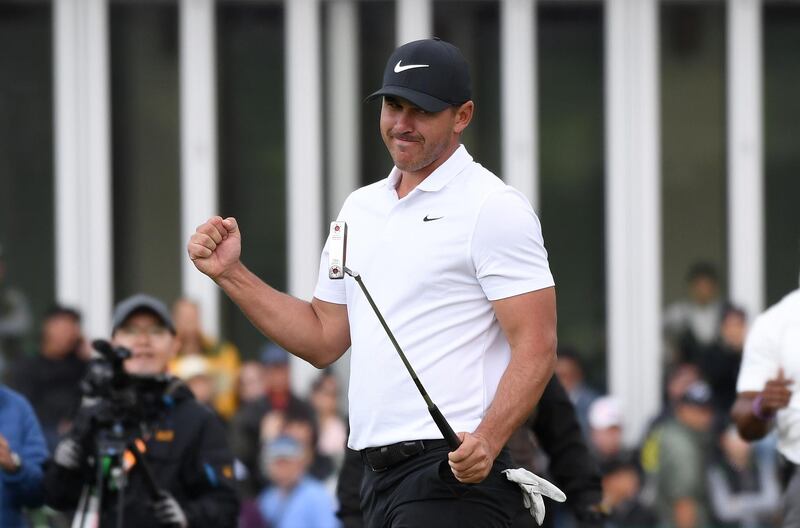 Brooks Koepka of the US reacts after winning putt on the eighteenth hole during the final round of the CJ Cup golf tournament at Nine Bridges golf club in Jeju Island on October 21, 2018. Triple major champion Brooks Koepka will overtake Dustin Johnson and Justin Rose to become world number one for the first time after winning the CJ Cup on October 21, by four strokes. / AFP / Jung Yeon-je
