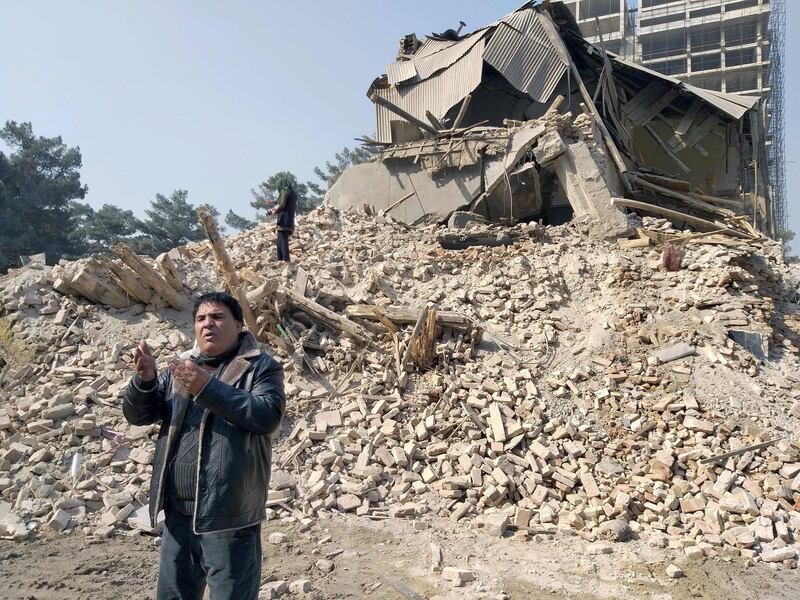 10 November 2020, Afghanistan, Kabul: Actor and film producer Salim Schahin stands in front of the "Cinema Park" cinema, which is being demolished. The demolition of the historic cinema has triggered sharp criticism. Filmmakers were outraged by the decision of the city administration. Photo: Hesam Hesamuddin/dpa (Photo by Hesam Hesamuddin/picture alliance via Getty Images)