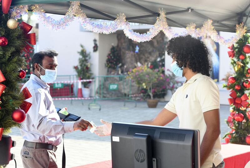 Abu Dhabi, United Arab Emirates - Registration checks for Christmas mass at St. JosephÕs Cathedral, in Mushrif. Khushnum Bhandari for The National