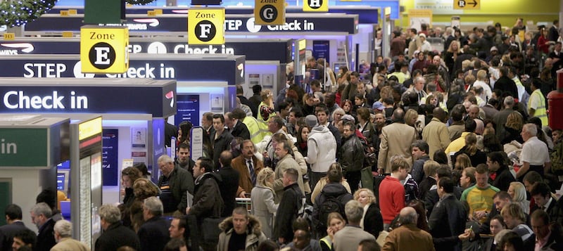 Passengers queue to check in at Terminal 1 of Heathrow Airport during the Christmas 2006 and New Year period