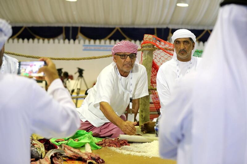 Dibba, United Arab Emirates - June 26, 2019: Fish is salted. Al Hosn fish salting festival. Wednesday the 26th of June 2019. Dibba. Chris Whiteoak / The National