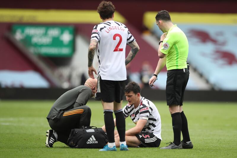 United defender Harry Maguire receives treatment for injury that would result in him substituted. AP