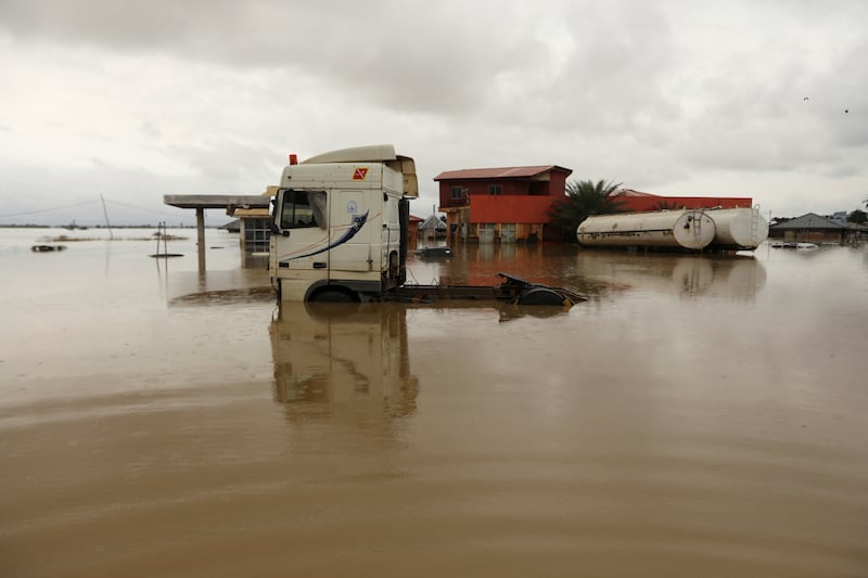 A lorry is partly submerged in flood water at a petrol station in Lokoja, Kogi state, in south-central Nigeria. Reuters