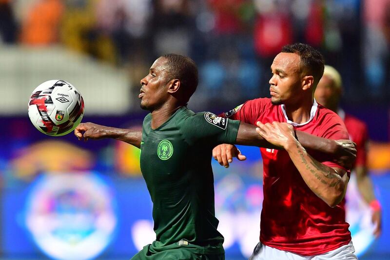 Nigeria forward Odion Ighalo, left, controls the ball in front of Madagascar defender Thomas Fontaine. AFP