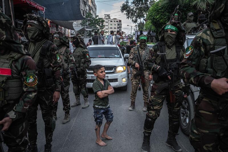 Fighters of Ezz al-Din Al-Qassam brigades, the military wing of Hamas, march in greeting to the Al Qassam commanders in Gaza Basim Issa in Gaza City in Gaza City, Gaza. The ceasefire between Israel and Hamas appeared to be holding, despite fresh clashes at Al-Aqsa Mosque in East Jerusalem. The ceasefire brings to an end eleven days of fighting which killed more than 250 Palestinians, many of them women and children, and 13 Israelis. The conflict began on May 10th after rising tensions in East Jerusalem and clashes at the Al Aqsa Mosque compound. Getty Images