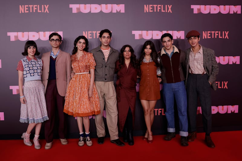 Director Zoya Akhtar with the cast of The Archies at Netflix's Tudum in Sao Paulo, Brazil. From left: Dot, Yuvraj Menda, Khushi Kapoor, Agastya Nanda, Suhana Khan, Vedang Raina and Mihir Ahuja. Getty Images