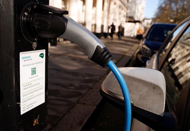 A vehicle is seen charging at an Ubitricity on-street electric vehicle charging point in London, Britain, in January 25, 2021. REUTERS/John Sibley