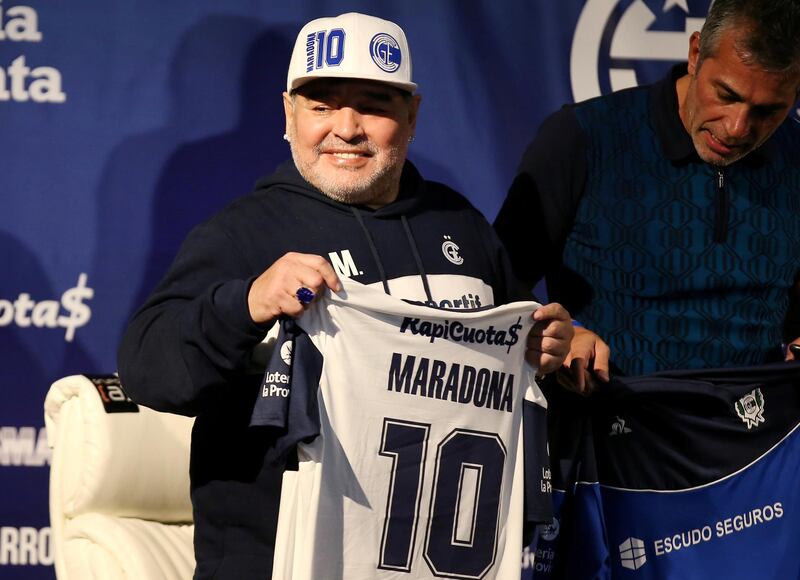 In this September 8, 2019 file photo, president of Gimnasia y Esgrima Gabriel Pellegrino and Diego Maradona during his presentation as new coach. Reuters