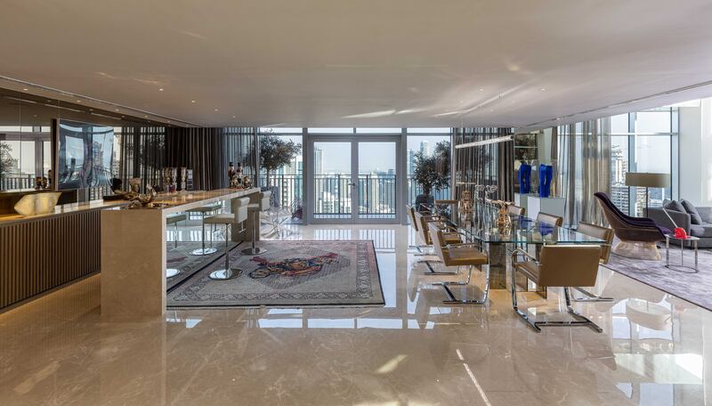 A bar and formal dining area adjacent to the living room.