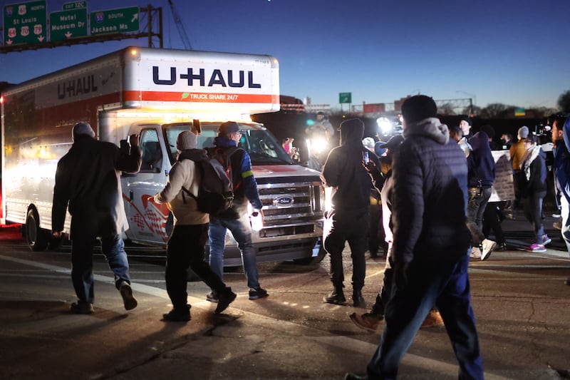 A large crowd marches down the interstate road in Memphis. AFP