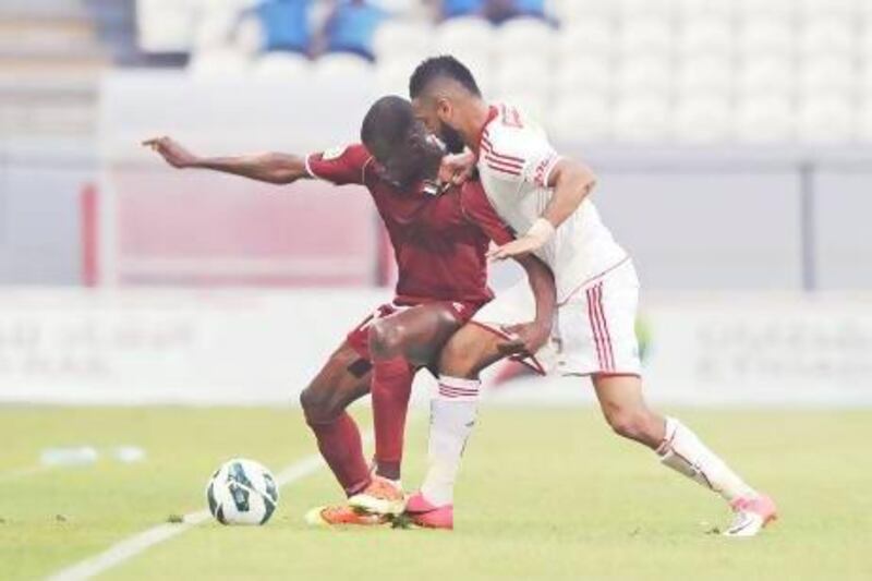 Josef Hickersberger saw out Al Wahda (red) to a 2-2 draw with Al Jazira (white). The Austrian, who was in charge for Wahda's final three games, will be replaced by Czech coach Karel Jarolim next season.