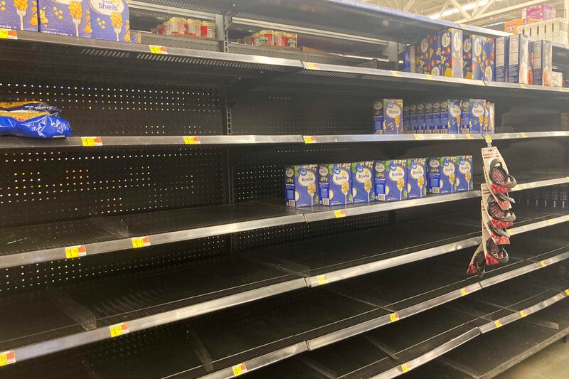 Shelves sit mostly empty in January at a Walmart in Anchorage, Alaska.  AP