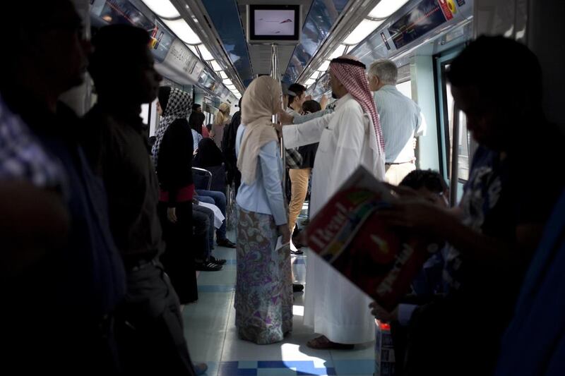 Commuters opt for the metro, leaving their cars at home in the interest of lowering pollution on car-free day in 2012. Razan Alzayani / The National