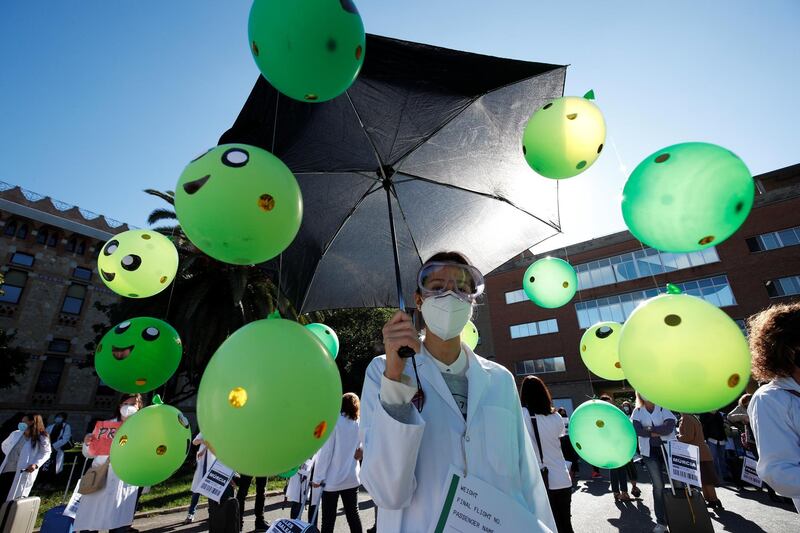 A Catalan doctor protests on the second day of a four-day strike to demand better working conditions amid the coronavirus outbreak, in Barcelona, Spain. Reuters