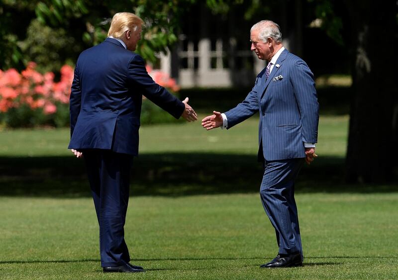 US President Donald Trump (L) shakes hands with Britain's Prince Charles, Prince of Wales (R) as he arrives for a welcome ceremony at Buckingham Palace in central London on June 3, 2019, on the first day of the US president and First Lady's three-day State Visit to the UK.  AFP