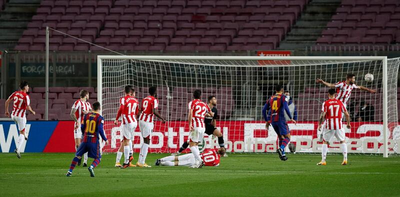 Barcelona's Lionel Messi scores from a free-kick to make it 1-0. Reuters