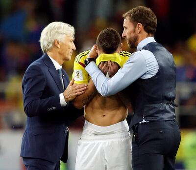 Soccer Football - World Cup - Round of 16 - Colombia vs England - Spartak Stadium, Moscow, Russia - July 3, 2018     England manager Gareth Southgate and Colombia coach Jose Pekerman with Colombia's Mateus Uribe after the penalty shootout     Picture taken July 3, 2018. REUTERS/Carl Recine