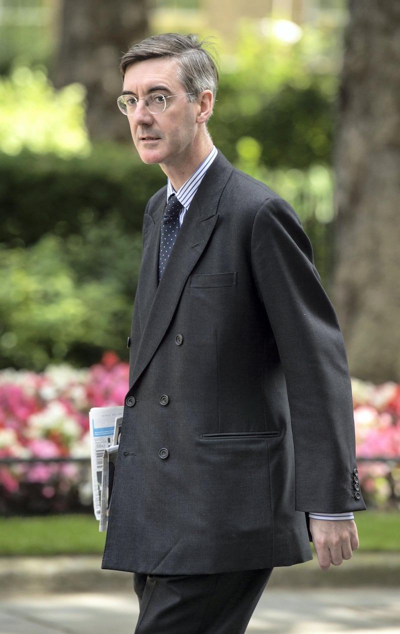 Jacob Rees-Mogg arrives at 10 Downing Street in London.