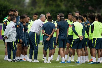 Brazil's head coach Tite, center left, talks to his players during a national soccer squad training session at the training facilities of Tottenham Hotspur football club in Enfield, England, Thursday, June 7, 2018. (AP Photo/Matt Dunham)