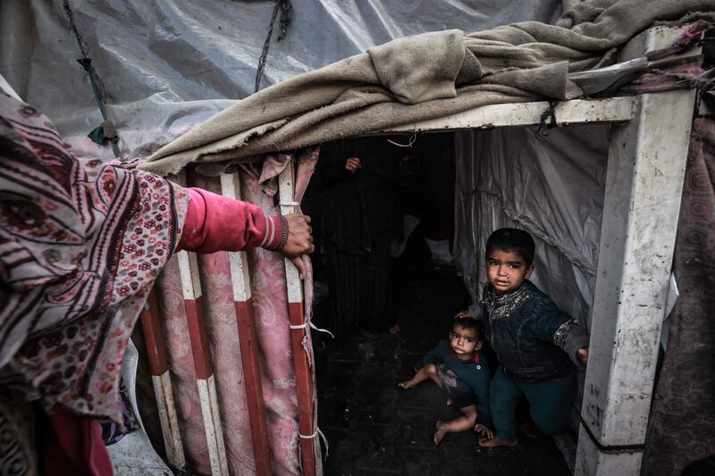 Palestinian children inside a makeshift tent at a camp in Rafah, southern Gaza. AFP