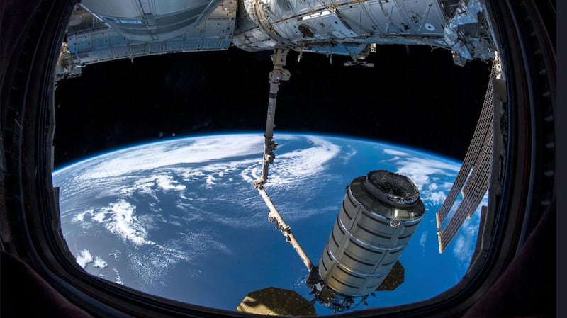 A shipment arrives at the International Space Station, where astronauts use a robotic arm to grab the 'SS John Young' cargo capsule, containing the UAE's MySat-1 satellite. SP