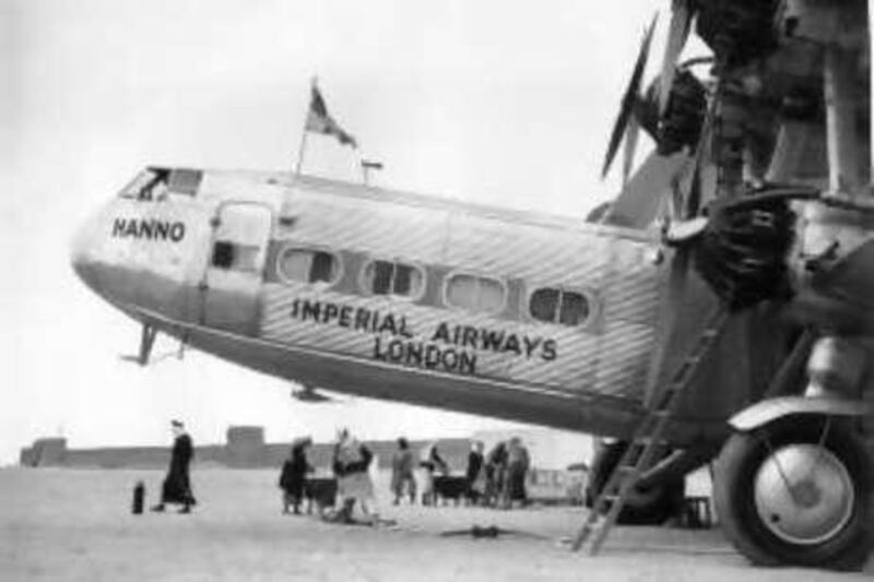 20th April 1934:  The Imperial Airways 'Hanno', Handley Page passenger aeroplane, carrying the England to India Airl mail, refuells at a desert stopover at Port Sharjah at Tricuial Oman, in the Persian Gulf.  (Photo by Fox Photos/Getty Images)