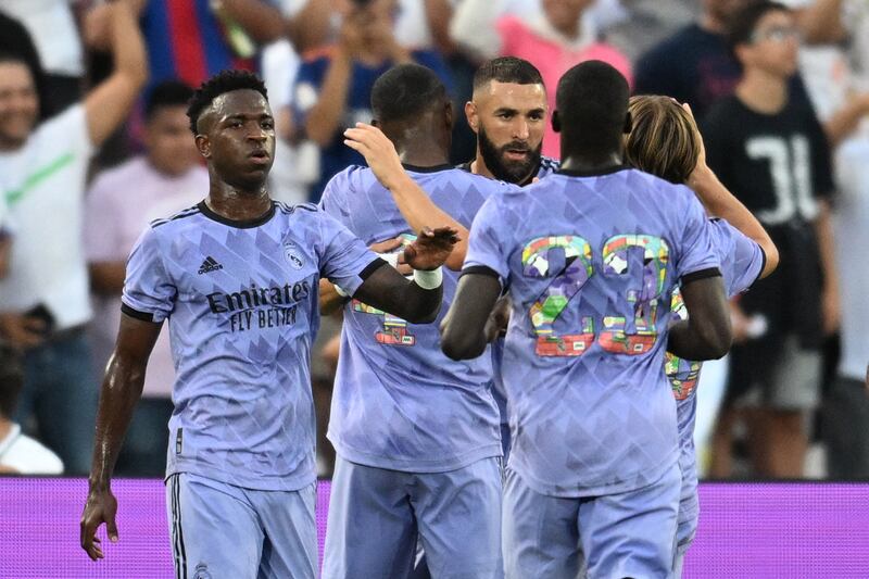 Karim Benzema celebrates with teammates after scoring for Real Madrid against Juventus in a pre-season friendly at the Rose Bowl in Pasadena, California, on July 30, 2022. AFP