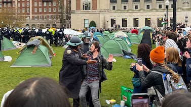 New York Police officers arrest a protester who took part in an encampment on the Columbia University campus on Thursday. AP