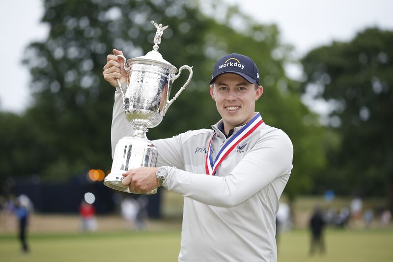 Matt Fitzpatrick of England celebrates with the US Open trophy at the Country Club on Sunday in Brookline, Massachusetts. AFP