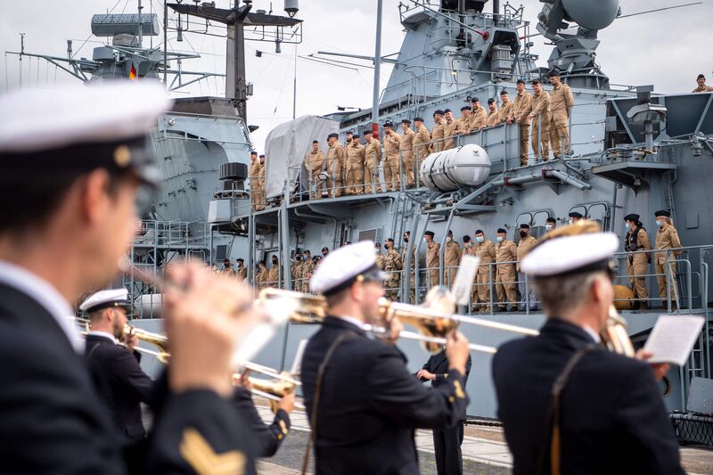 Members of a Marine brass band play for their comrades as the frigate 'Bayern' of the German Marine leaves the port of Wilhelmshaven for a seven-month exercise trip between the Horn of Africa, Australia and Japan. AFP