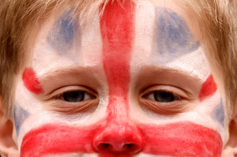 A child has a Union Jack flag painted on his face for a party in St James' Church in London. Reuters