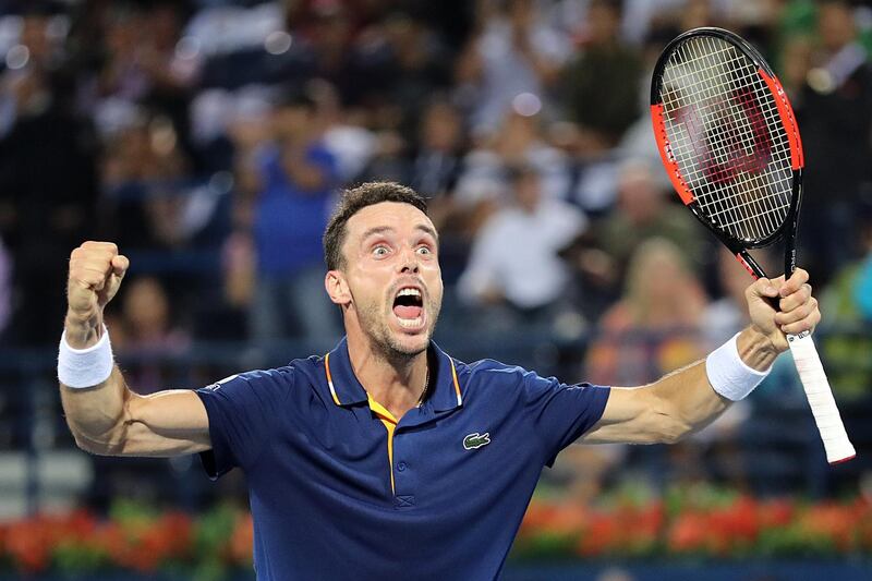 epaselect epa06577567 Roberto Bautista Agut of Spain celebrates after winning the Men's Singles Final match against Lucas Pouille of France in the ATP Dubai Duty Free Tennis Championships in Dubai, United Arab Emirates, 03 March 2018.  EPA/MAHMOUD KHALED