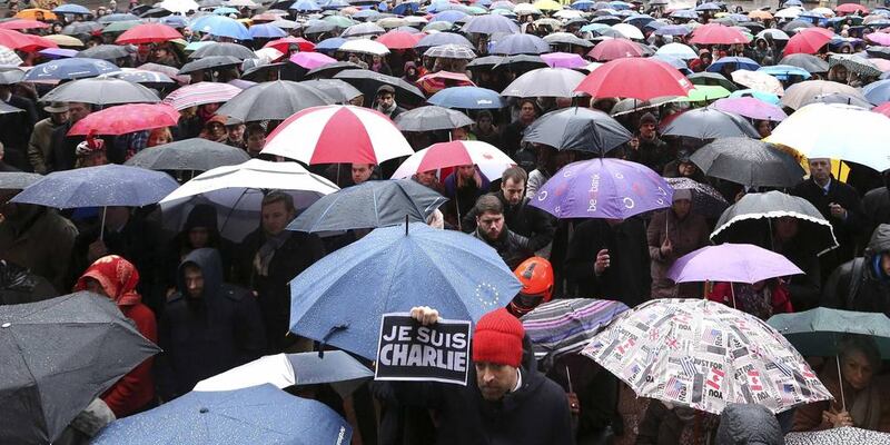 A man holds a placard that reads “I am Charlie” as European MPs and citizens gather in front of the EU Parliament in Brussels on January 8, 2015, to observe a minute of silence for victims of the shooting at French weekly newspaper Charlie Hebdo. Francois Lenoir / Reuters