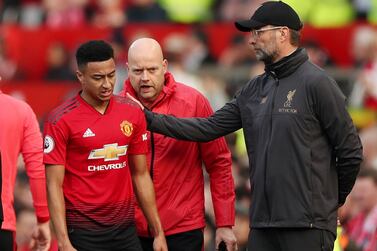 Soccer Football - Premier League - Manchester United v Liverpool - Old Trafford, Manchester, Britain - February 24, 2019 Manchester United's Jesse Lingard with Liverpool manager Juergen Klopp as he is substituted off Action Images via Reuters/Lee Smith EDITORIAL USE ONLY. No use with unauthorized audio, video, data, fixture lists, club/league logos or "live" services. Online in-match use limited to 75 images, no video emulation. No use in betting, games or single club/league/player publications. Please contact your account representative for further details.