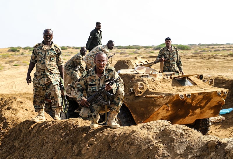 Fighters from a Saudi-backed Sudanese-Yemeni military force battling Huthi rebels are pictured on May 23, 2021 near the border with Saudi Arabia in Yemen's northern coastal town of Midi, located in conflict-ridden Hajjah governorate. - Yemen's conflict since 2014, pitting the Iran-backed Huthis against the government supported by a Saudi-led military coalition, has killed tens of thousands of people and pushed millions to the brink of famine. (Photo by Mohammed al-WAFI / AFP)