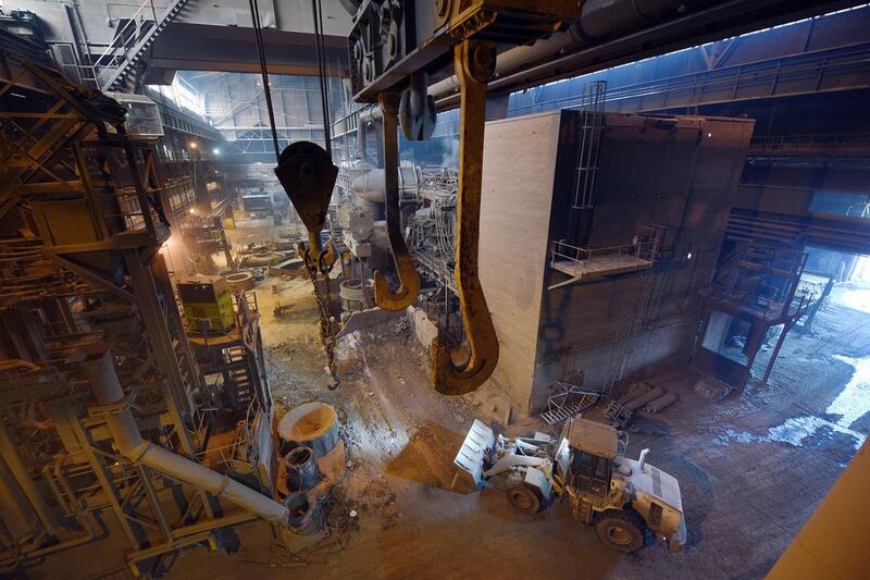 A front loader moves across the floor of the melt shop. Oli Scarff / AFP