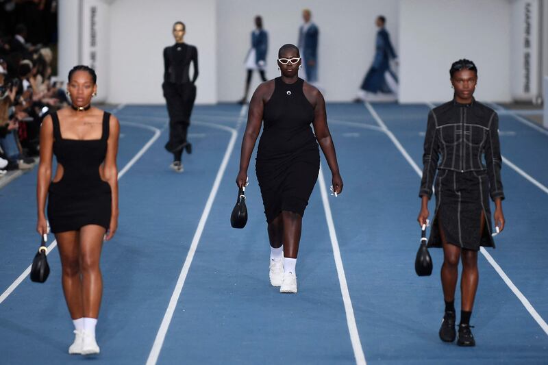 Models present creations by Marine Serre during the menswear ready-to-wear spring/summer 2023 at Fashion Week in Paris on June 25, 2022. AFP