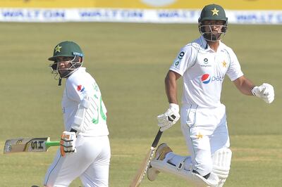 Pakistan's Abid Ali, left, and teammate Abdullah Shafiq run between the wickets during the fifth day of the first Test against Bangladesh. AFP