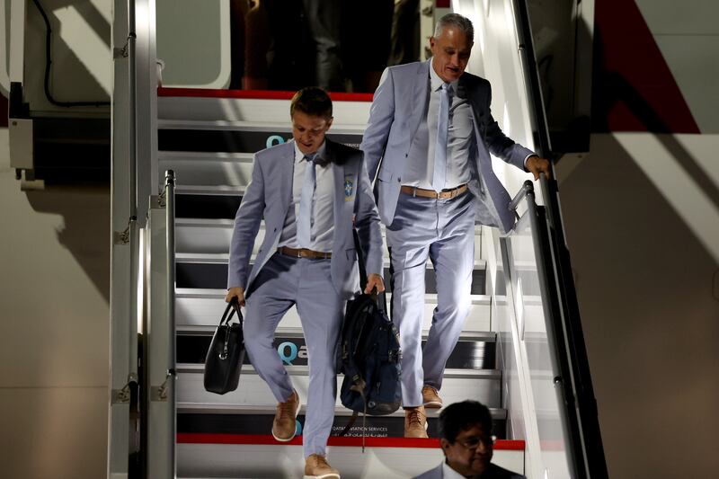 Brazil's head coach Tite disembarks from an aircraft upon arrival at Hamad International Airport. Getty