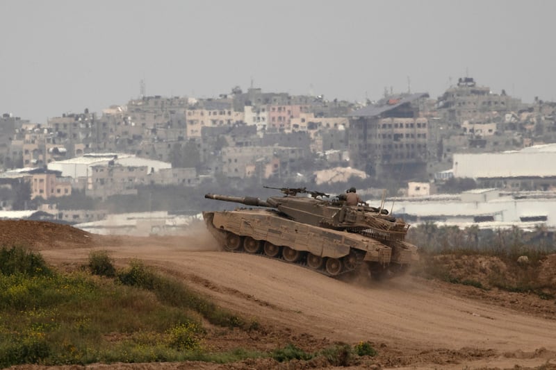 An Israeli tank moves near the border with the Gaza Strip on March 17, 2024 in southern Israel. Getty Images