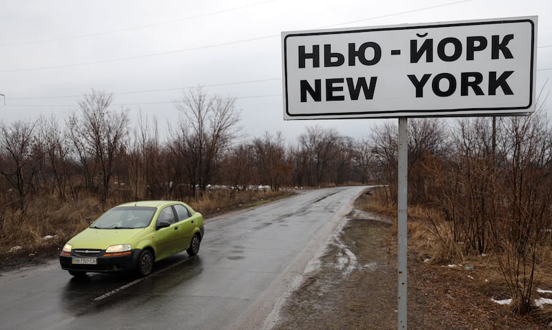 A road sign not far from a front line near pro-Russian militants controlled city of Donetsk, in Ukraine. The settlement first appeared on maps in 1846 under its original name of New York. In 1951 its name was changed to Novgorodskoye amid worsening USSR-US relations. In July 2021 the Ukrainian parliament renamed it New York.  EPA